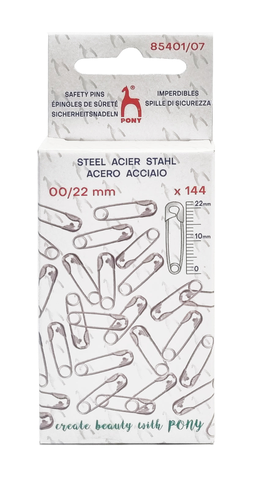 A package of PONY brand safety pins, model 85401/07. The white cardboard box features illustrations of silver safety pins, a printed measurement scale, and the text 'STEEL ACIER STAHL' and '00/22 mm x 144'.