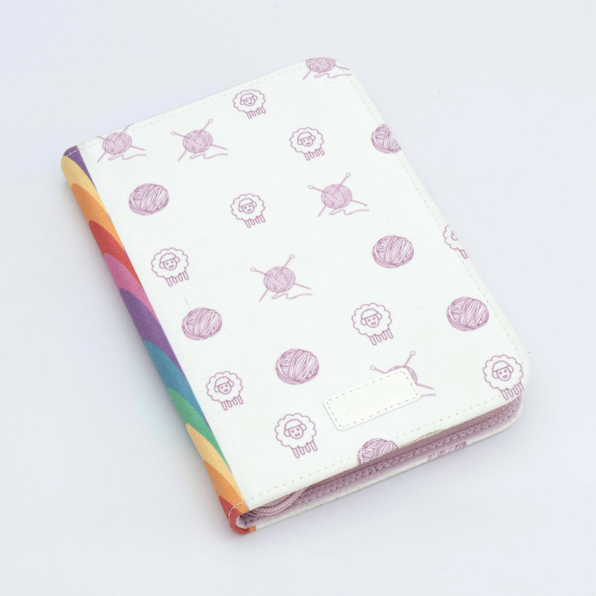 KnitPro Symfonie 2 Normal interchangeable needle set, 13 cm, Deluxe - Folded fabric with yarn and knitting needles pattern on a white background