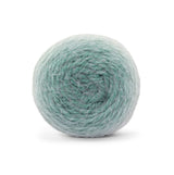 Círculo Marfim – Acrylic Gradient Cake Yarn (400 m / 200 g) - Ball of light gren yarn on a white background