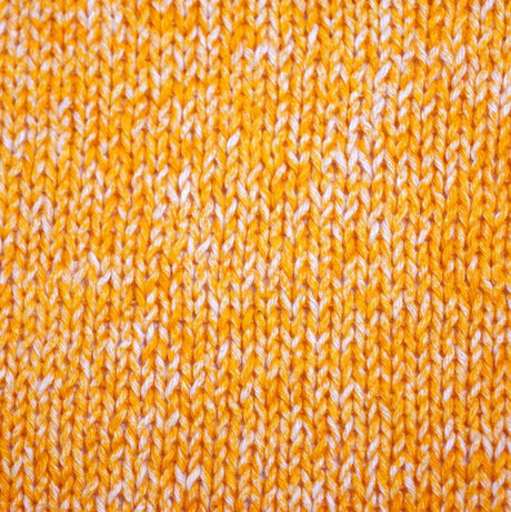 Hand-knitted sample made from Circulo JEANS 100% Cotton yarn in Cheddar color, demonstrating the denim effect and vibrant color in a cozy garment.