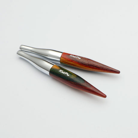 KnitPro Symfonie 2 Mini interchangeable needle tips, 5 cm - Two pointed wooden tools with silver metal collars, displayed diagonally on a clean white background. The wood features a marbled pattern of reddish-brown, dark brown, and green, with the brand name 'Ralph Lauren' printed in white script.