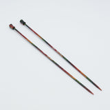 KnitPro Symfonie 2 single pointed knitting needles, 25 cm - Two long knitting needles with a multicolor gradient design transitioning from dark green to red and orange, photographed on a plain white background.